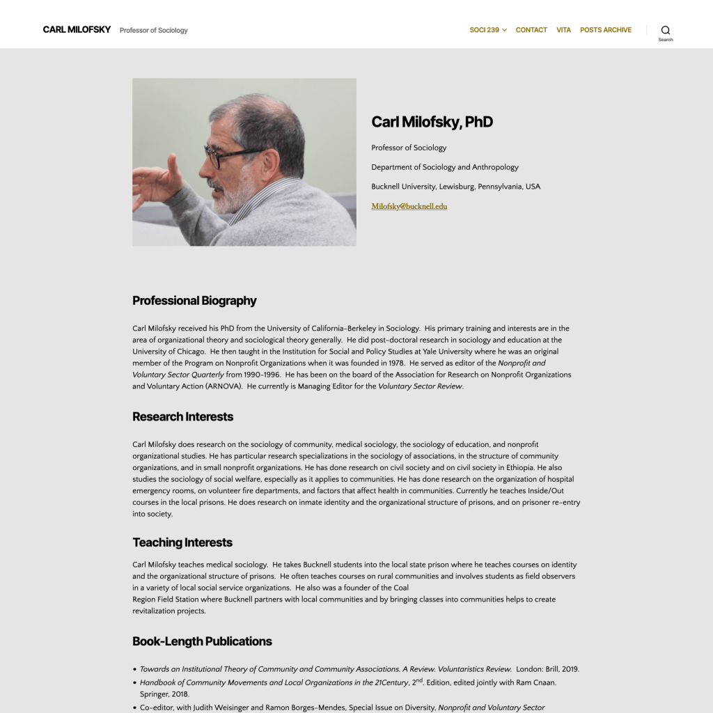 A professor engaging in discussion, showcasing their profile in an academic environment.